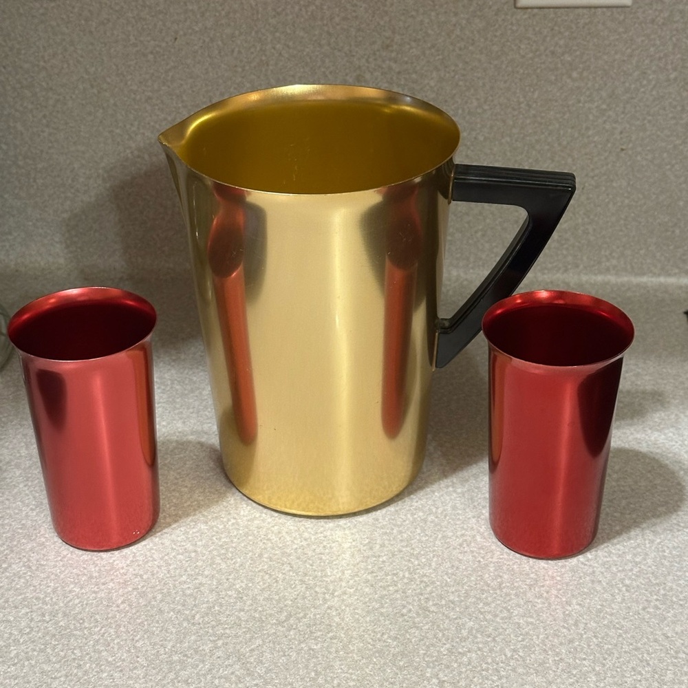 Vintage aluminum pitcher with Red aluminum Cups